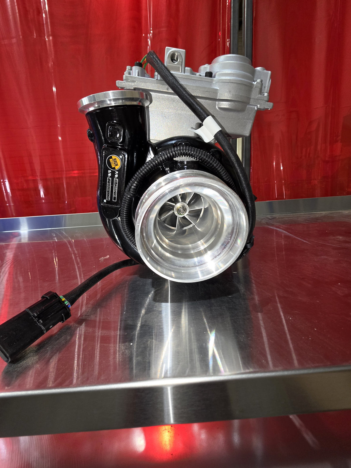 Hack Nation ISX-15 Stage 1 Turbo NEW VGT w/ Actuator (HN-C2882112) full view on shop table